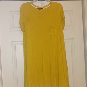 A mustard mid length dress